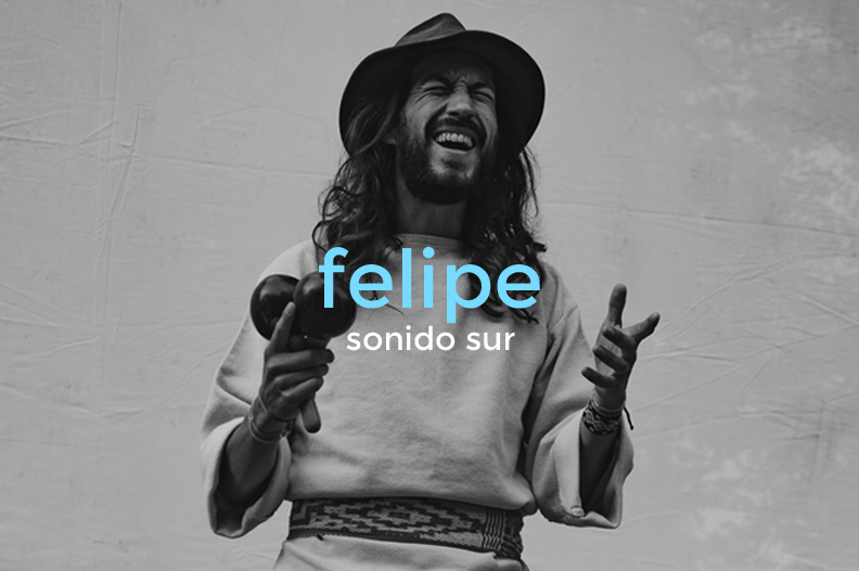 Black and white photo of a man with long hair and a beard, wearing a hat and a sweatshirt, holding a hairdryer, smiling or laughing, with text on image saying 'felipe' in blue and 'sonido sur' in white.