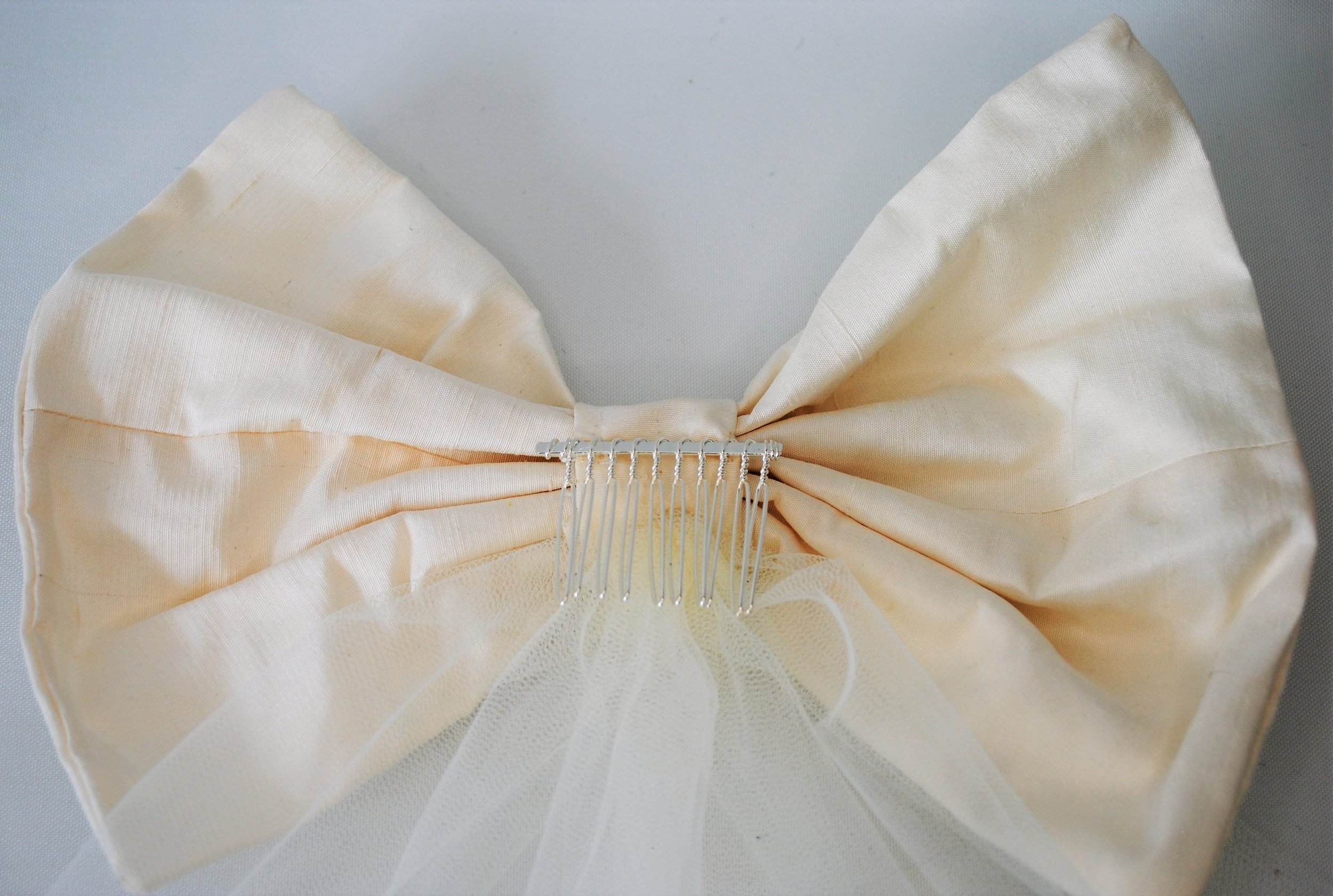 single ivory bow bk.jpeg