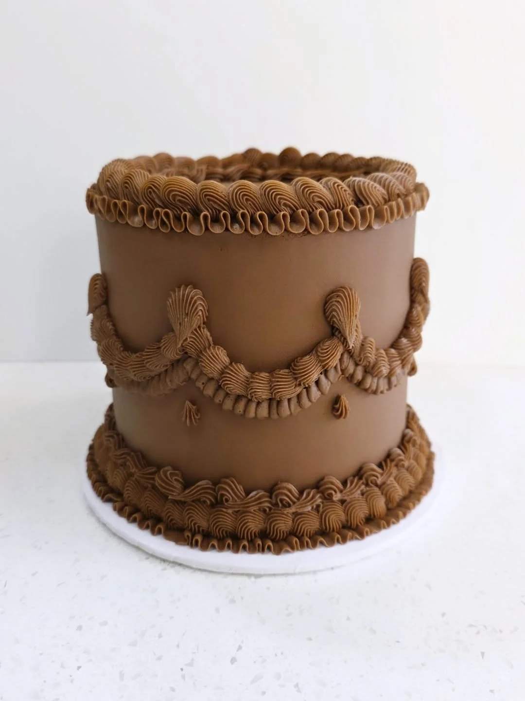 This cutie is up for auction tonight for the Cochrane Pregnancy Center! Vanilla cake with fresh strawberries and chocolate buttercream 🤰
.
.
.
#auction #vintagecake #lambethcake #rufflecake #2025cake #cake #cakedecorating #cakesofinstagram #cakestag