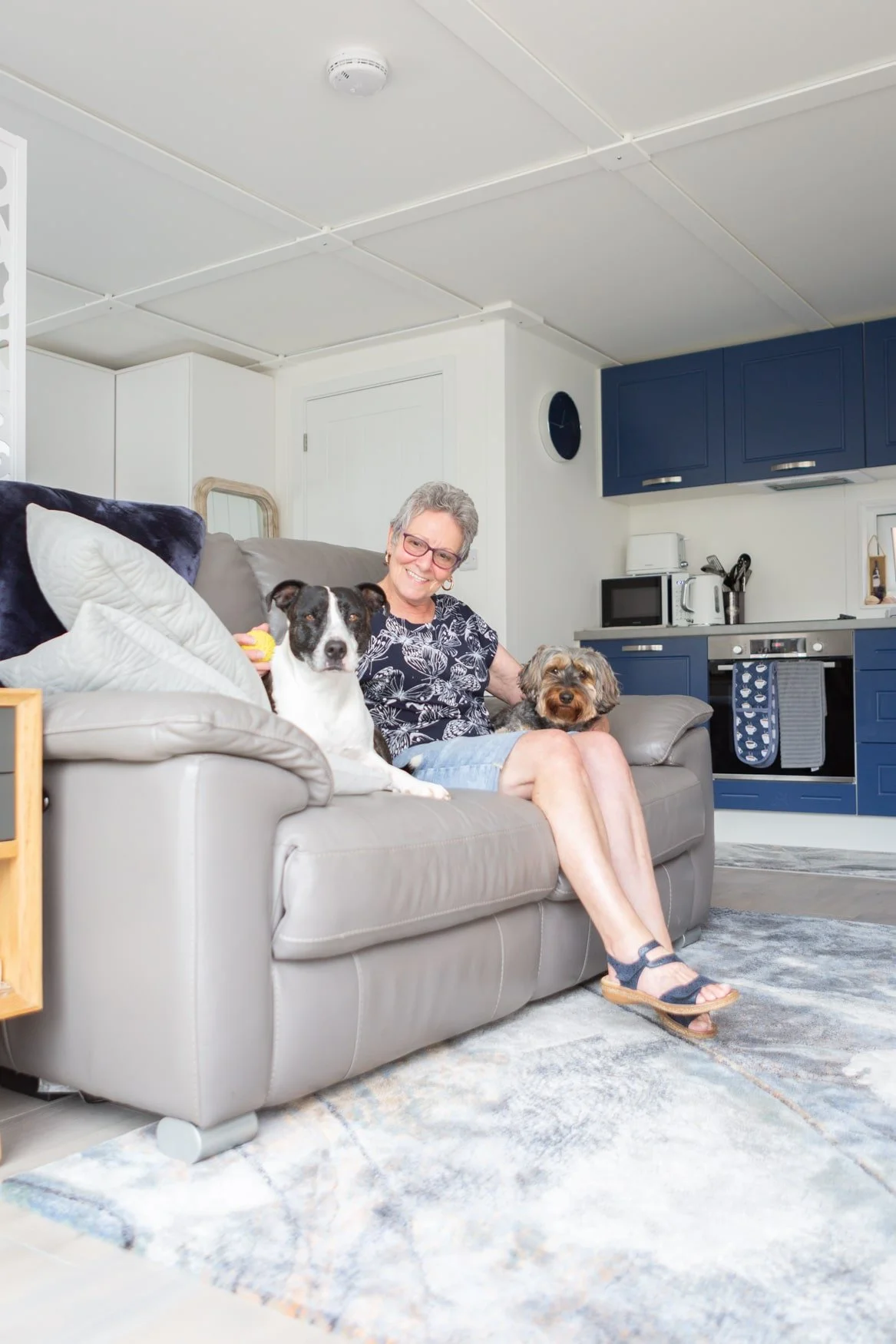 A handover scene showing homeowners receiving keys to their new garden annexe in Hertfordshire.
