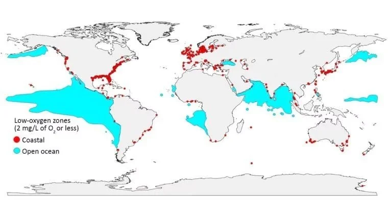 World map showing low-oxygen zones (red dots) mostly along coastlines and open oceans, with some in the Arctic, Atlantic, Indian, and Pacific Oceans.
