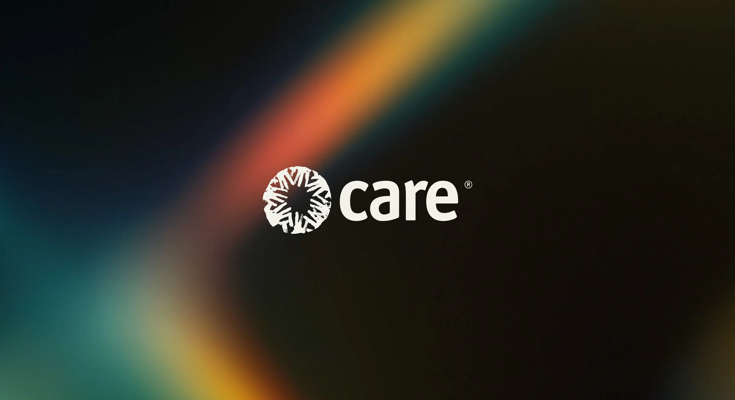 CARE logo white on a dark background