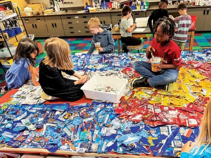 Hanging in Bluff Lake's office headquarters is a special piece of artwork, created by second graders at Isabella Bird Community School. Students visited Bluff Lake 3 times, collecting trash around the site and turning it into something beautiful! Our