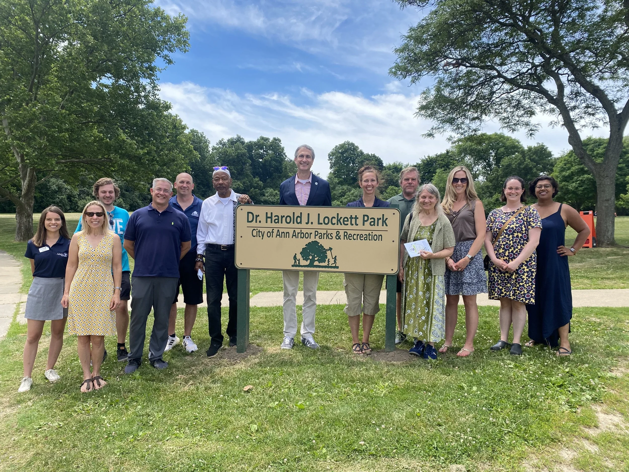 Mayor Taylor and others standing at the Dr. Harold J Lockett Park.