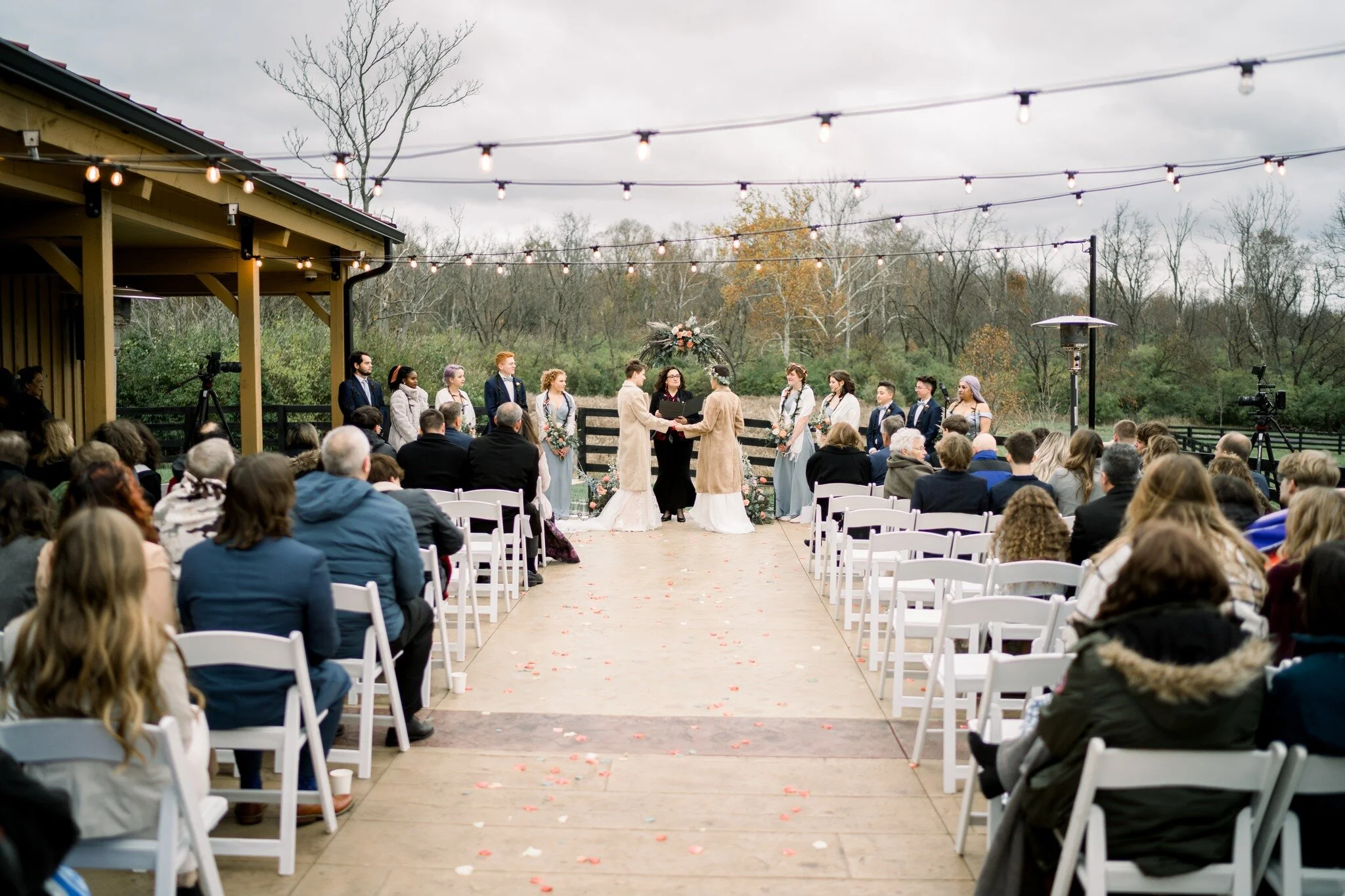 🎼The snow is snowing, the wind is blowing
But I can weather the storm
What do I care how much it may storm?
I've got my love to keep me warm

Lauren and Hannah's beautiful winter wedding on the Veranda was certainly one of our favorite ceremonies.

