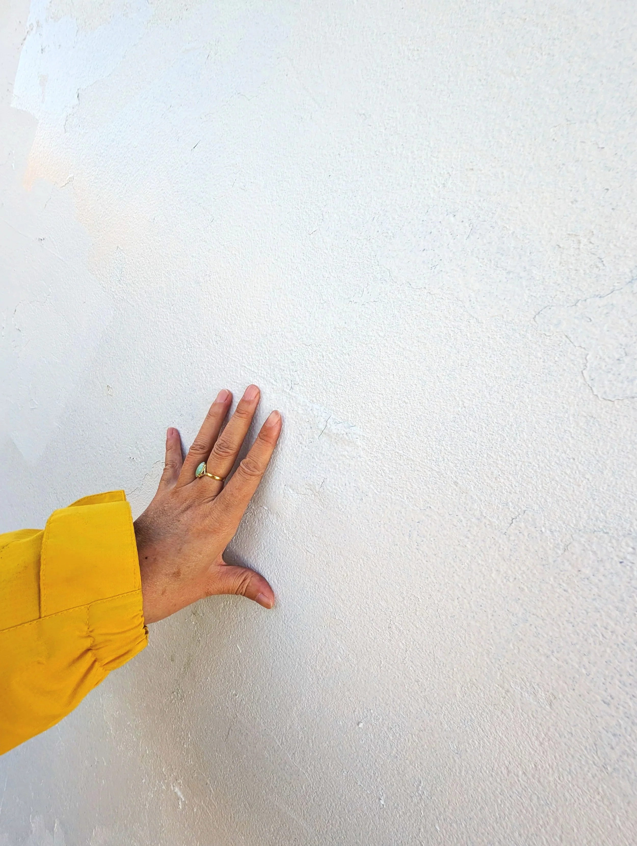 Jingmin Ren examining the surface of Bondi Sea Wall during the site-specific research and development of Solar Longitude – Time Orbit, Sydney, 2026.