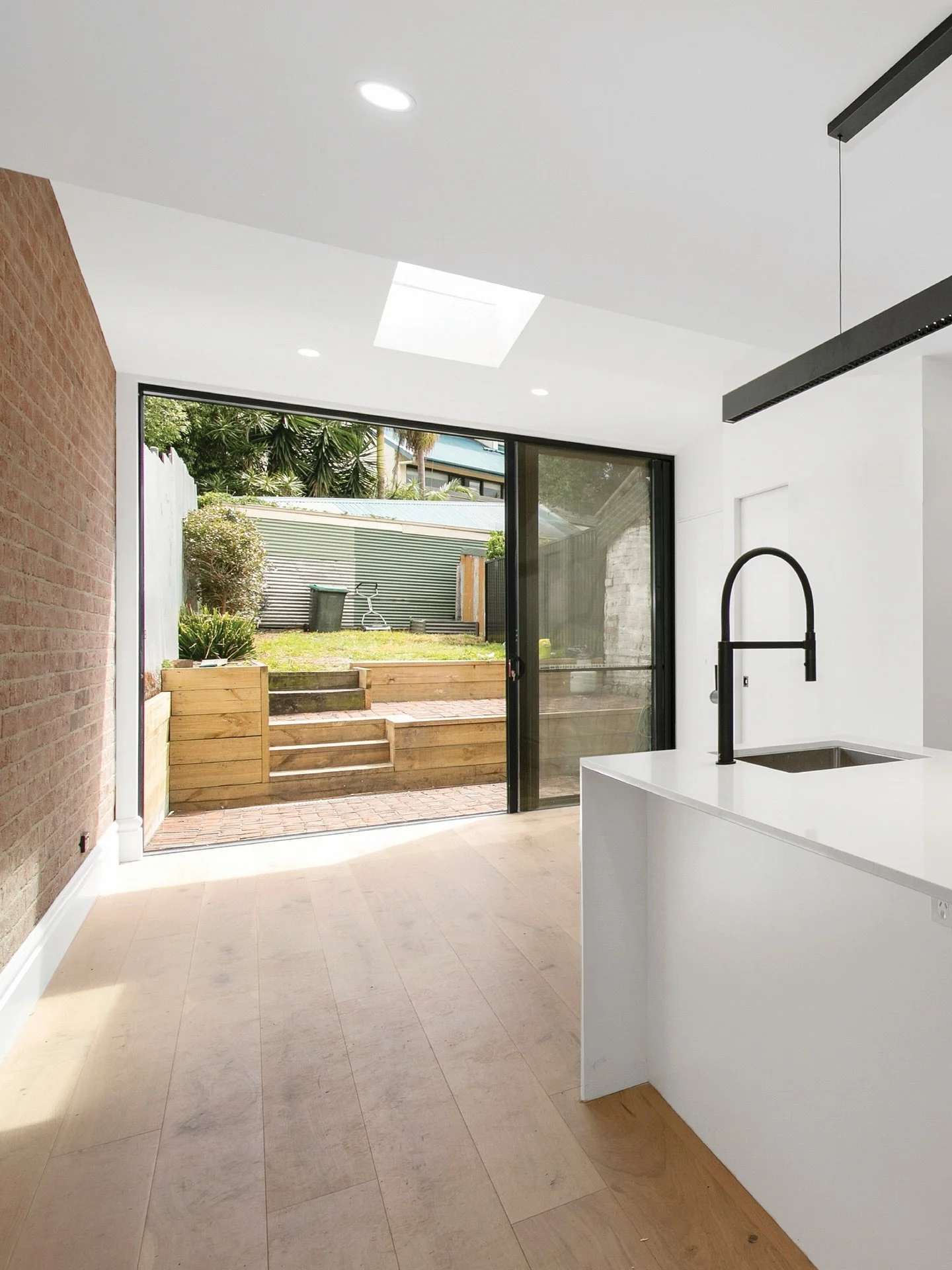 From dark terrace to light filled living ✨

Our Bull Street project reimagined this Cooks Hill home with a skylit kitchen, a large glass slider opening to the backyard, and a clean open layout. Smart updates, fresh spaces, and a whole lot more light.