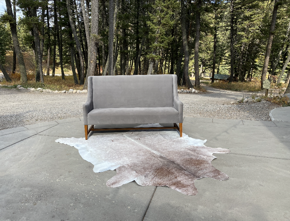 gray-couch-wildwood-rentals-cowhide-2.png