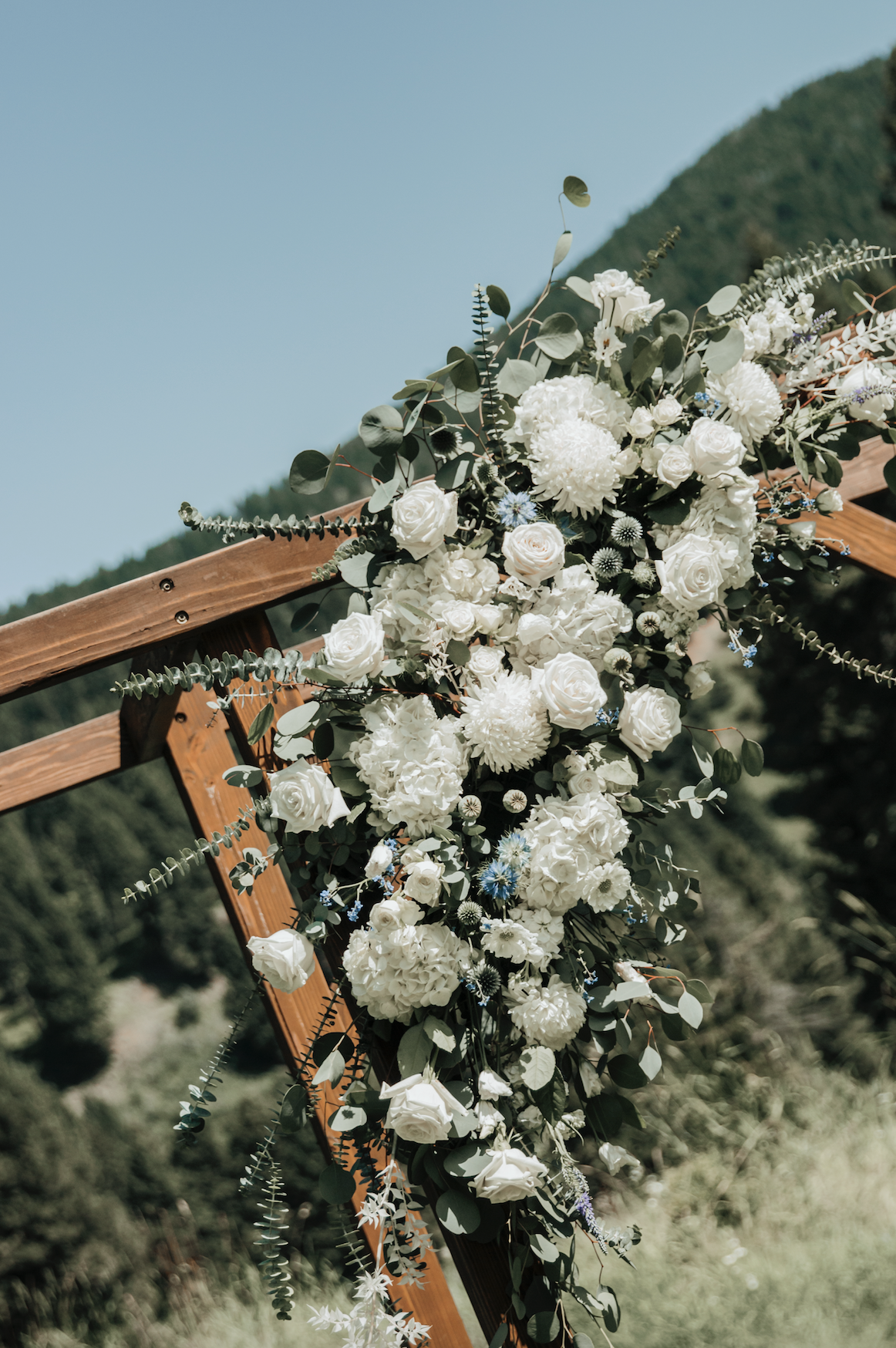 Wedding-in-montana-ceremony-spot-white-flower-arch-montana-diaries.png