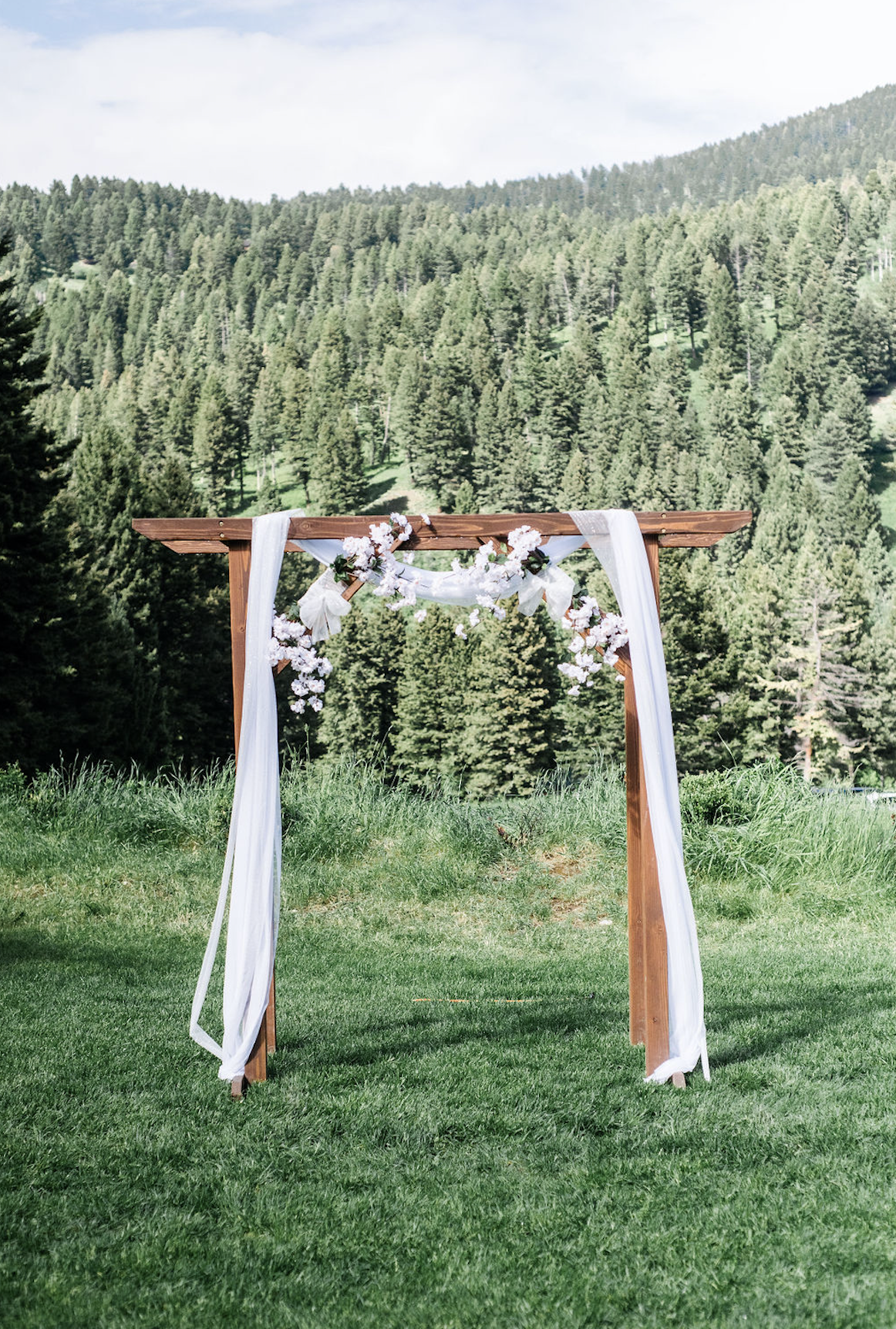 White-flowers-arch-wedding2-woodlands-kody-dustin.png