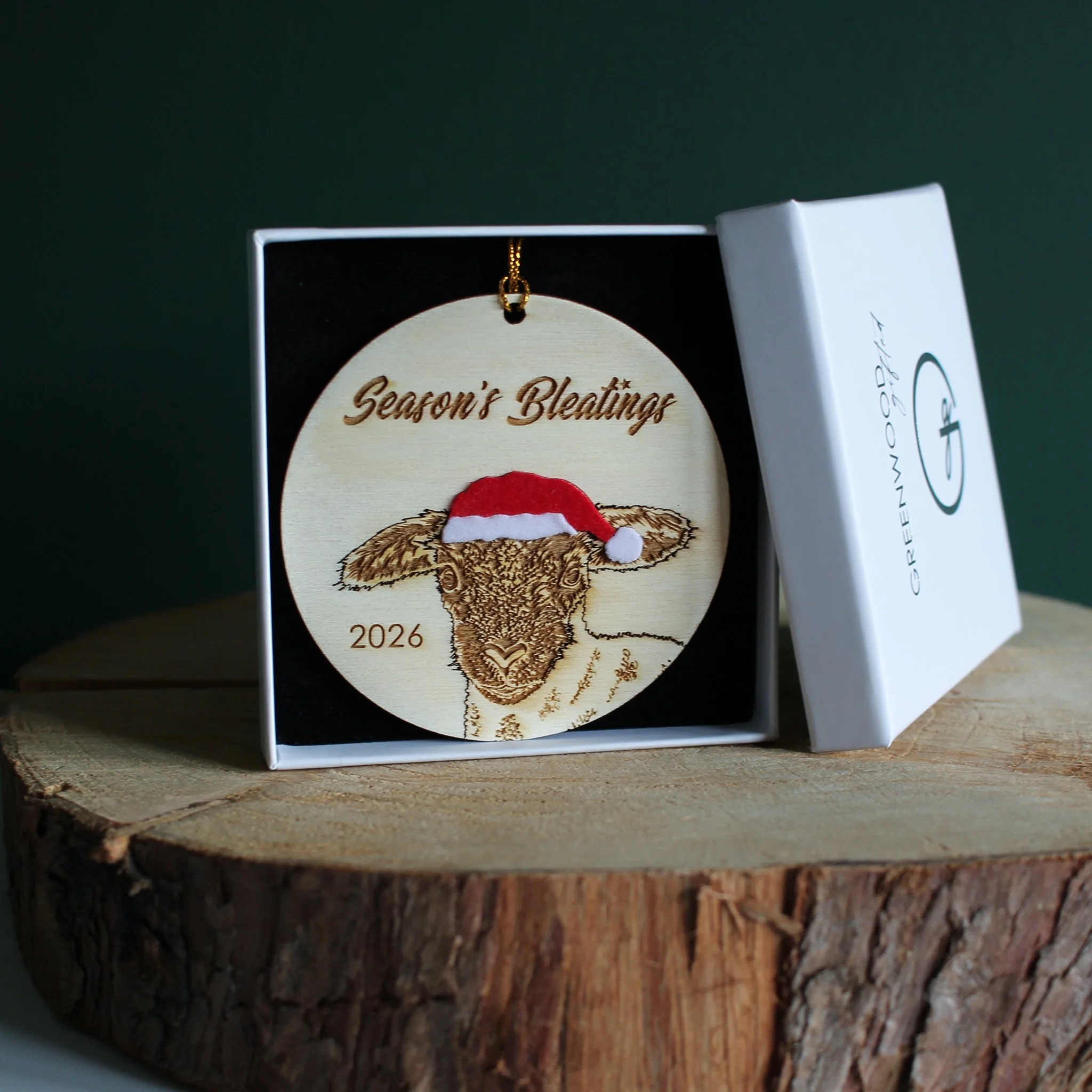 Wooden lamb Christmas ornament with optional 2026 year engraving, presented in a white Greenwood Gifted gift box with black insert.