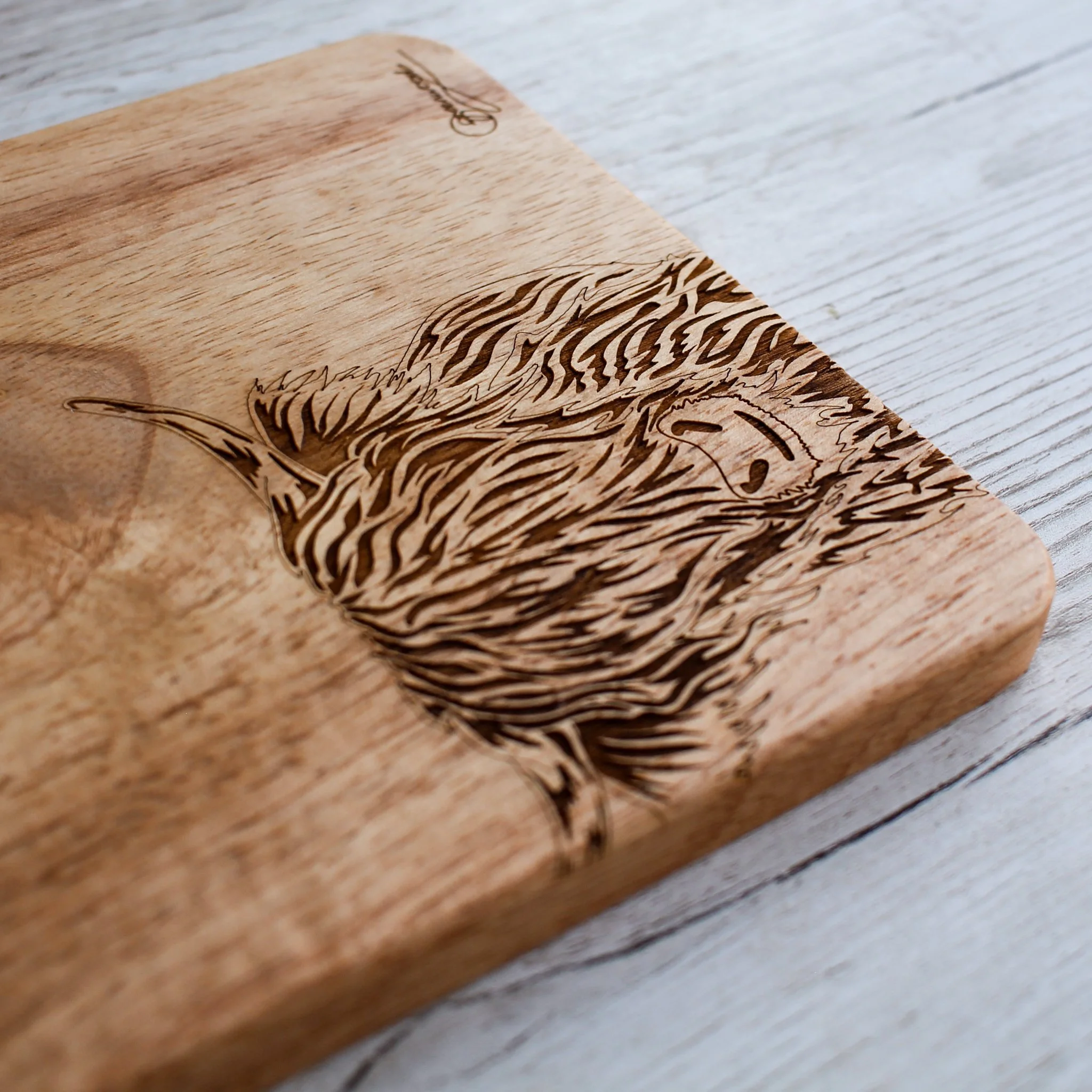 Side shot of chopping board showing the depth of the board and the engraving.