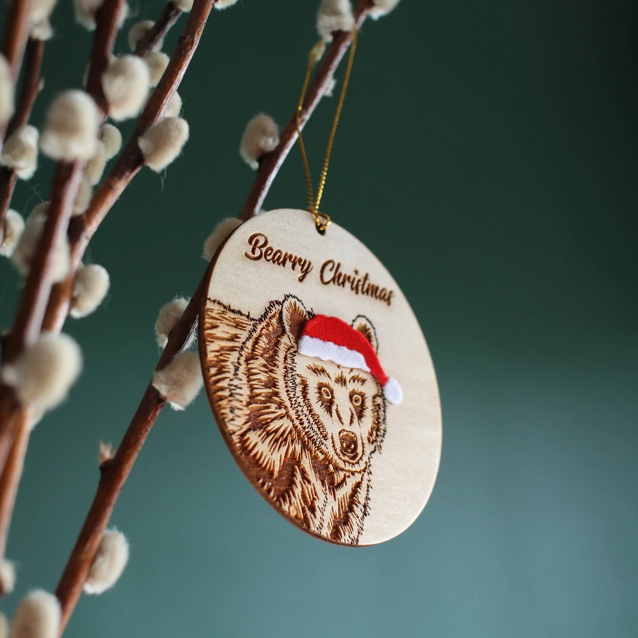 Oblique, upward view of hanging Bear ornament. The mix of texture and layers add interest to this handcrafted, original piece.