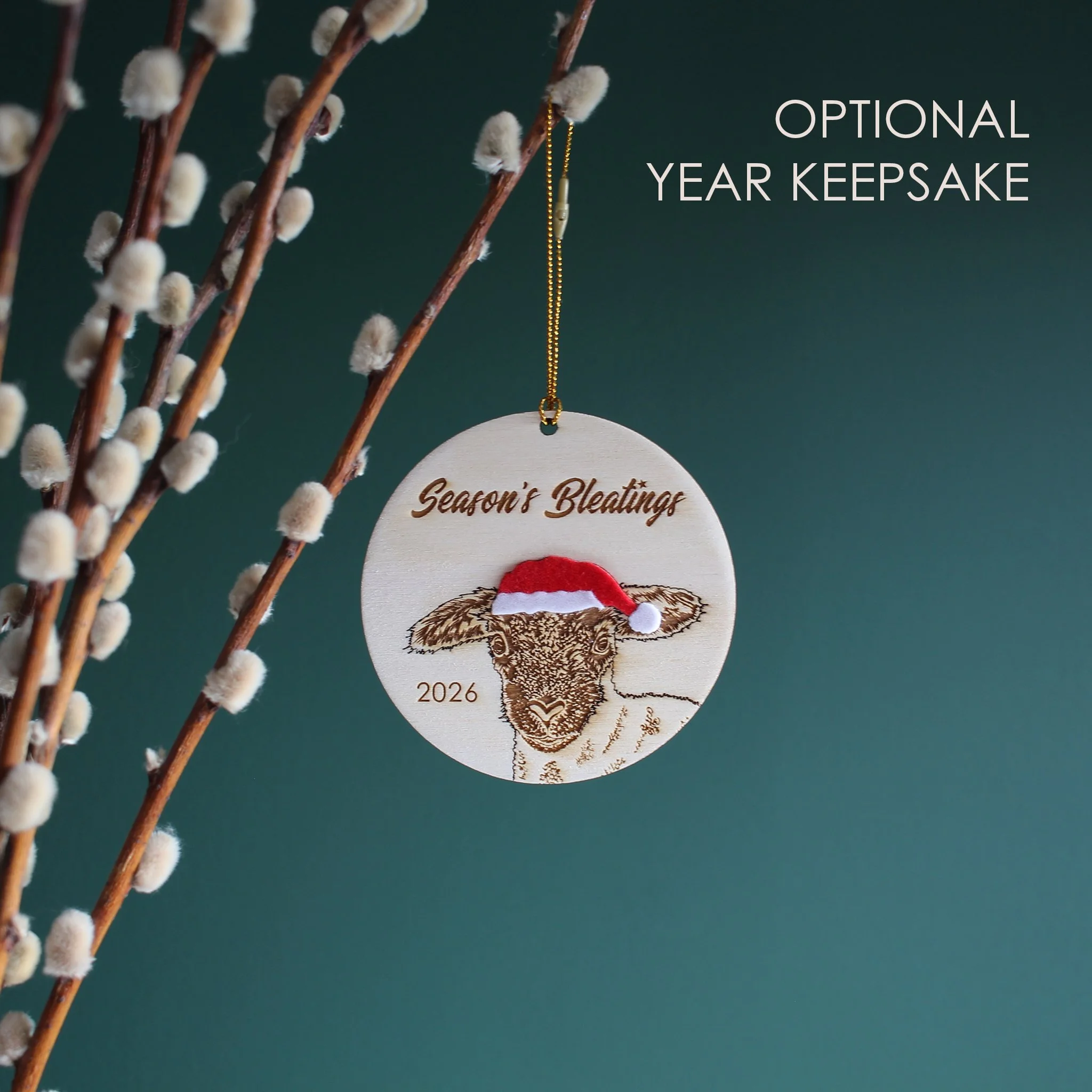 Wooden lamb Christmas ornament with optional 2026 year engraving, featuring an original hand-drawn raccoon in a Santa hat and festive Christmas pun.