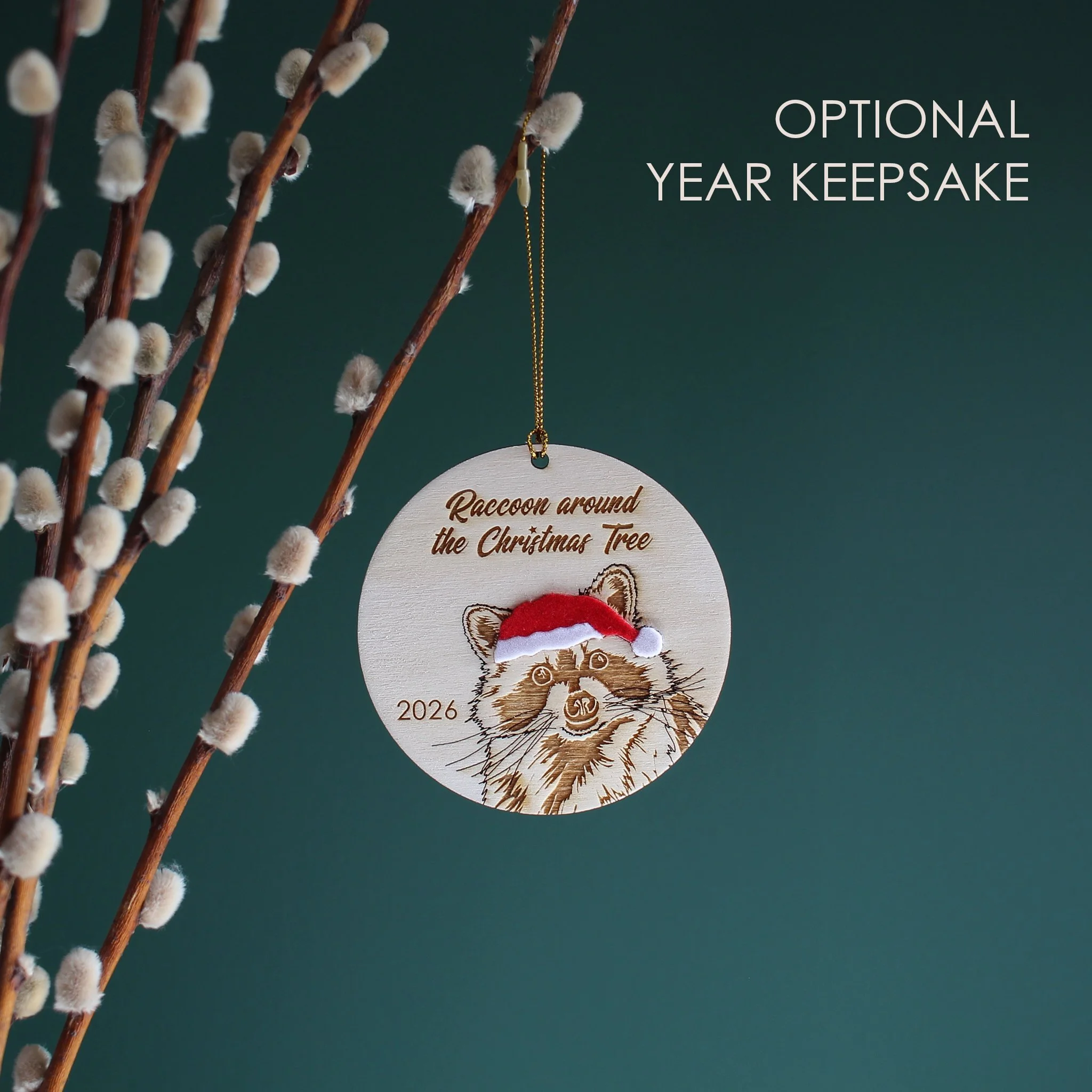 Wooden raccoon Christmas ornament with optional 2026 year engraving, featuring an original hand-drawn raccoon in a Santa hat and festive Christmas pun.