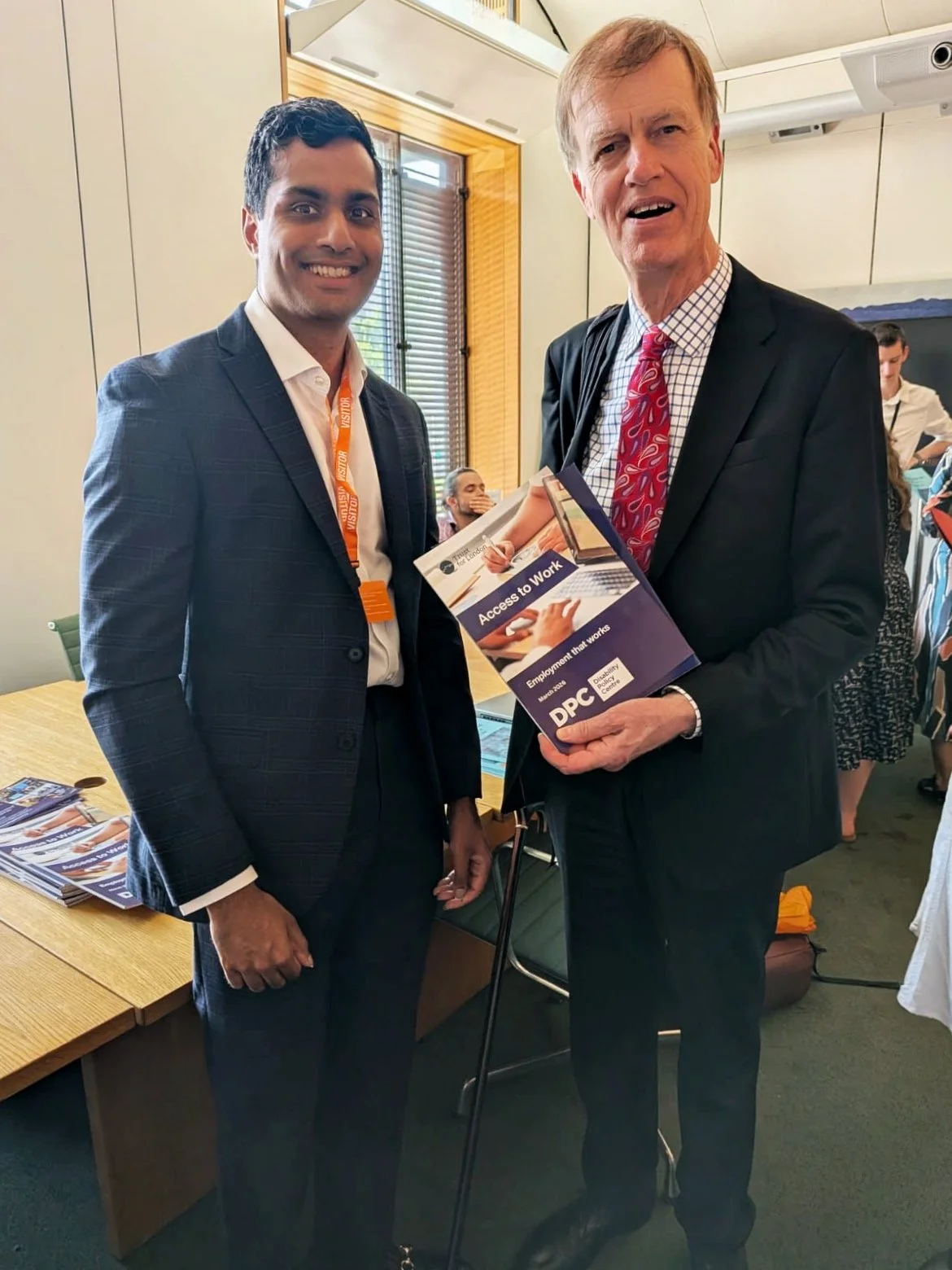 Arun from the Disability Policy Centre stands with Disability Minister Sir Stephen Timms, who is holding the DPC’s Access to Work: Employment that Works report during the parliamentary drop-in event.
