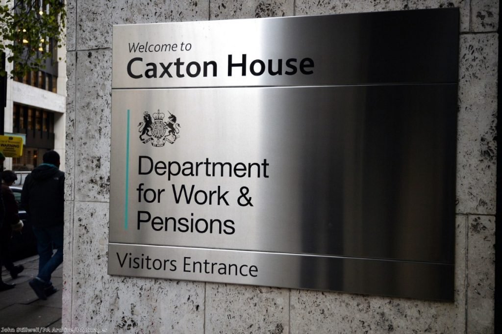 Photograph of silver signage outside DWP building.