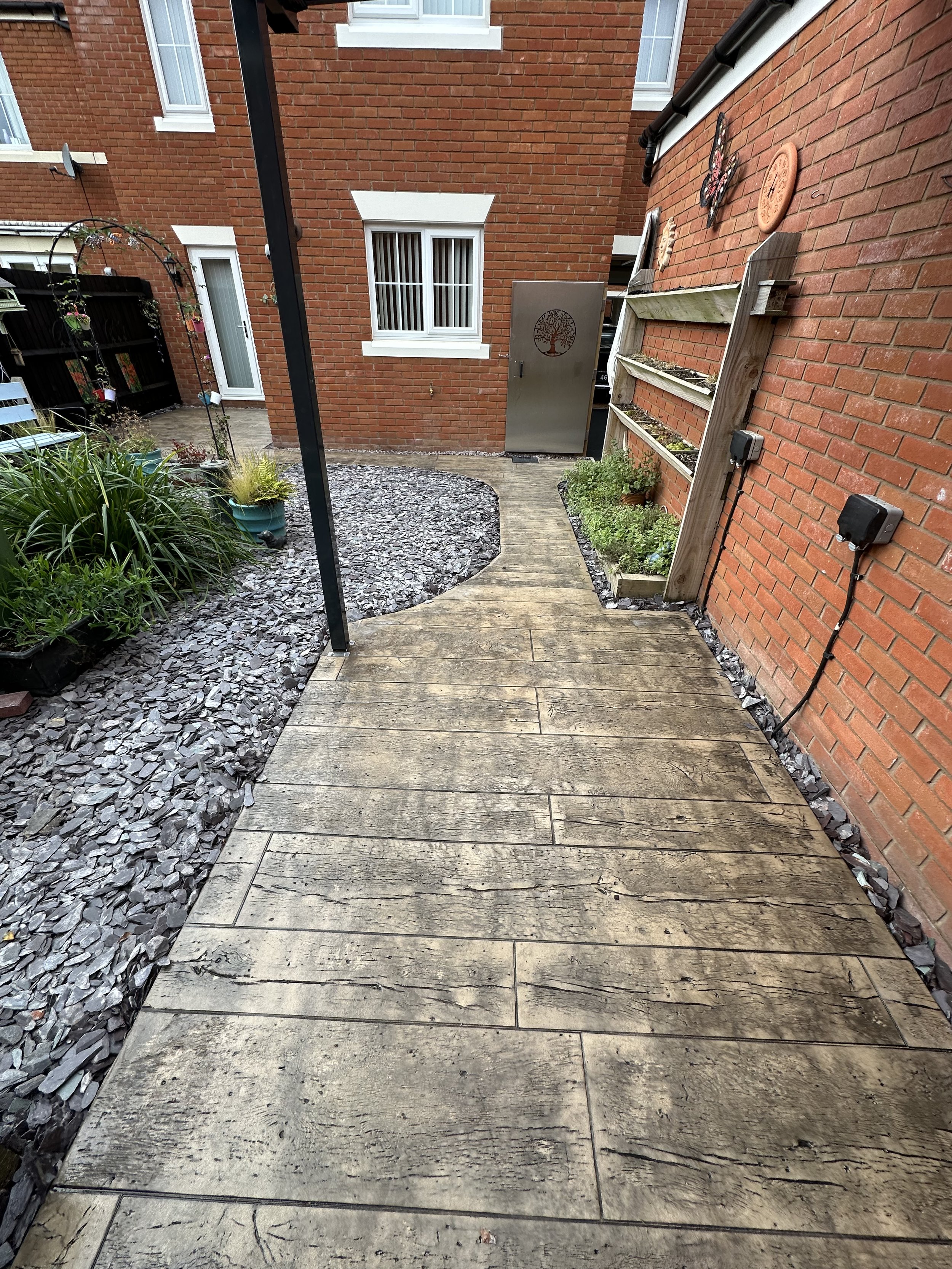 Reclaimed Timber printed concrete in biscuit. Shropshire Landscaping, Shrewsbury