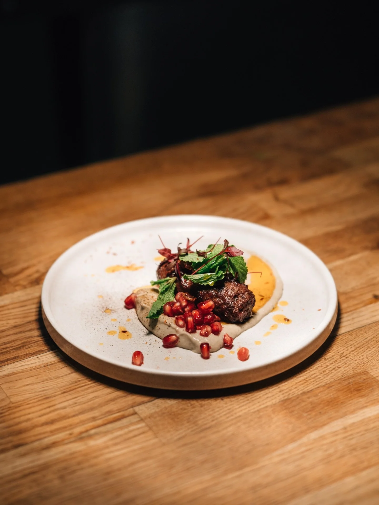 Venison kofta, perfectly spiced and beautifully charred, served with smoky aubergine, fresh mint, and vibrant pomegranate seeds for a burst of sweetness and freshness.

This dish was part of our Whole Beast Feast: Venison Edition, celebrating bold, s