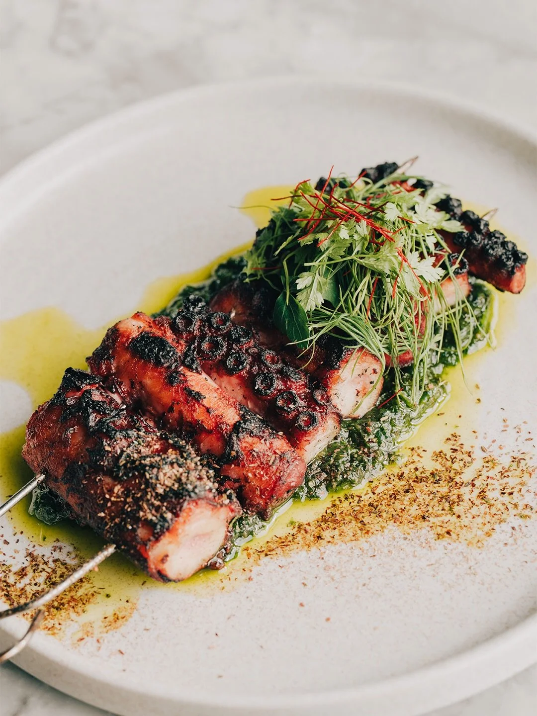 New on the menu.

Wood fired South Coast octopus, wild caught from the day boats, served with vibrant zhug and finished over the fire for that perfect char. Great produce with real provenance, cooked simply to let the flavour shine.

Part of our smal