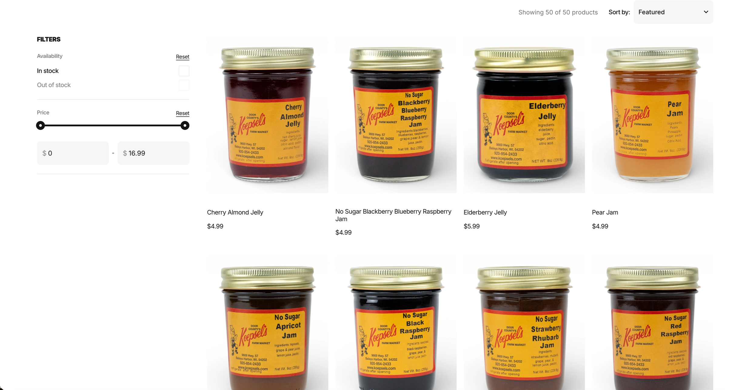 Array of seven jars of jam with gold lids and yellow labels, featuring flavors such as cherry almond, blueberry raspberry, elderberry, pear, apricot, black raspberry, strawberry rhubarb, and red raspberry.