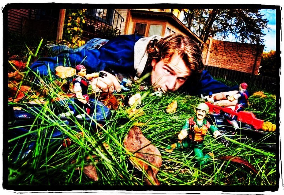 Comedians at home: Zach Coulter in his yard with his GI Joes