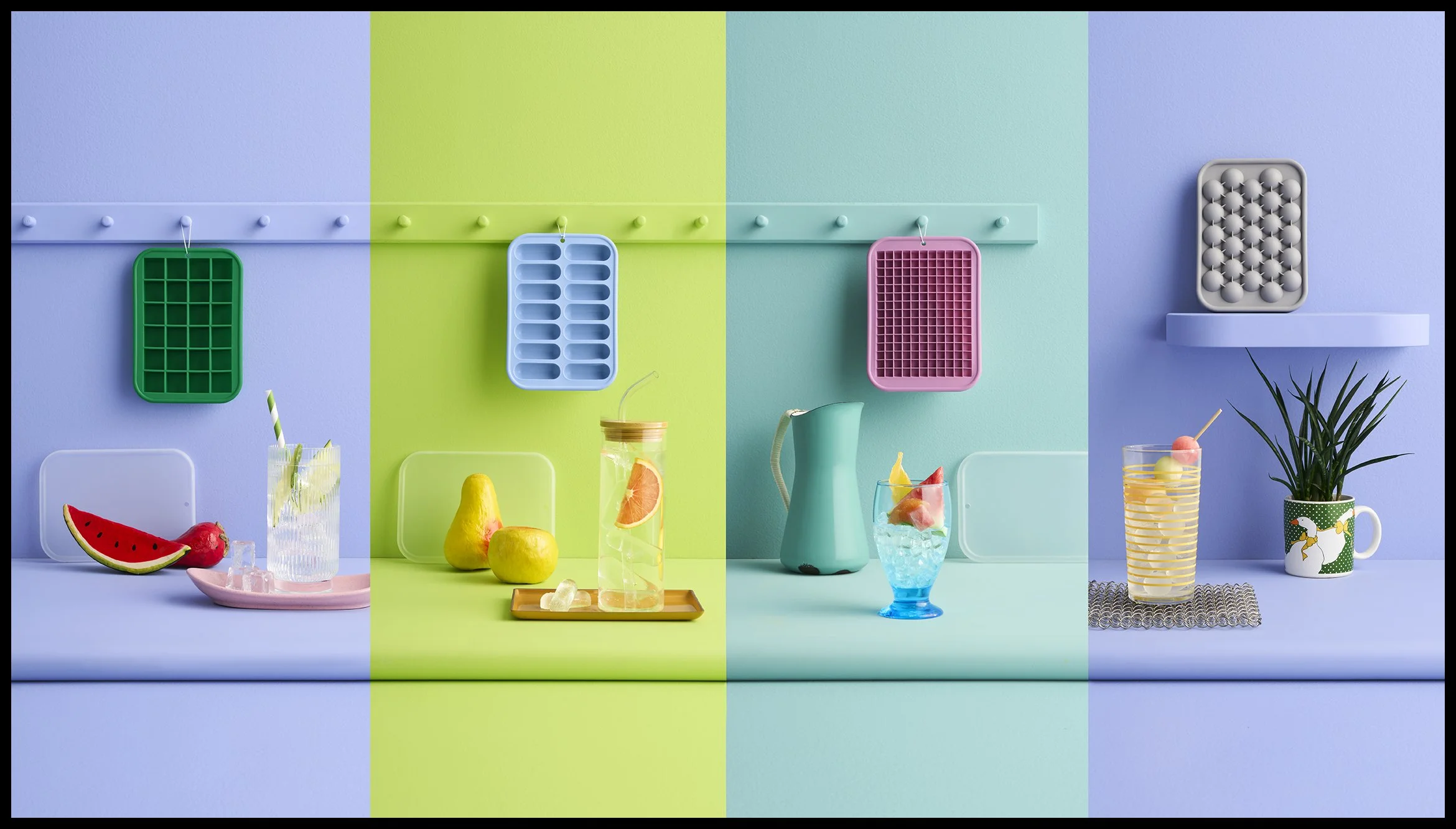 Colorful scene with drinks and fruit on pastel-colored surfaces, with textured wall panels and a potted plant in a decorative mug.  Target RE Room Essentials Silicone Ice Tray with Lid Product Advertising Photography KyleSmithPhoto