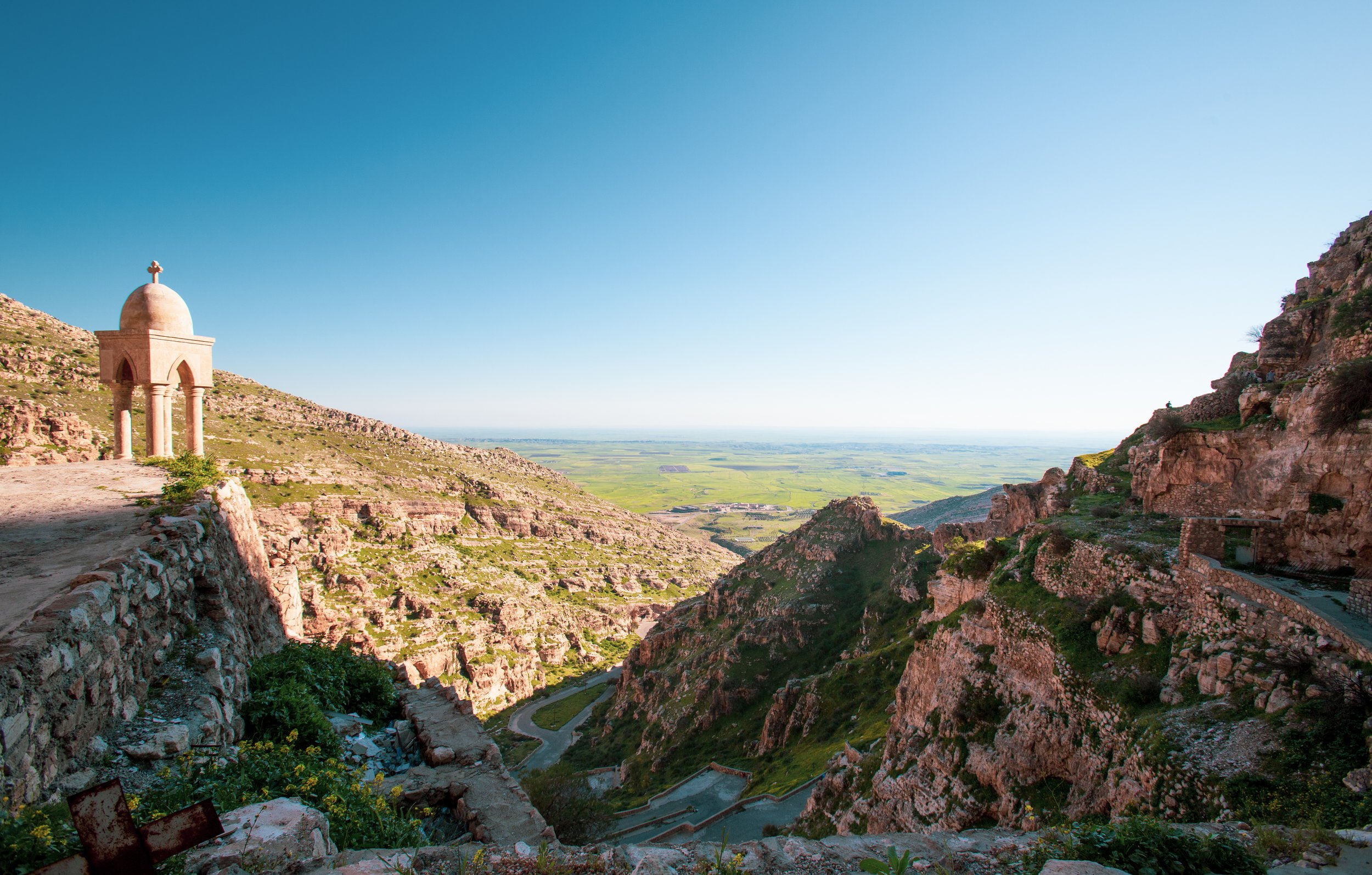 Overlook from one of the oldest monasteries in the world. This has been in continual use for roughly 1,400 years, and is quite large, with many rooms carved into the mountainside for the monks. With the invasion of ISIS it has started falling into di