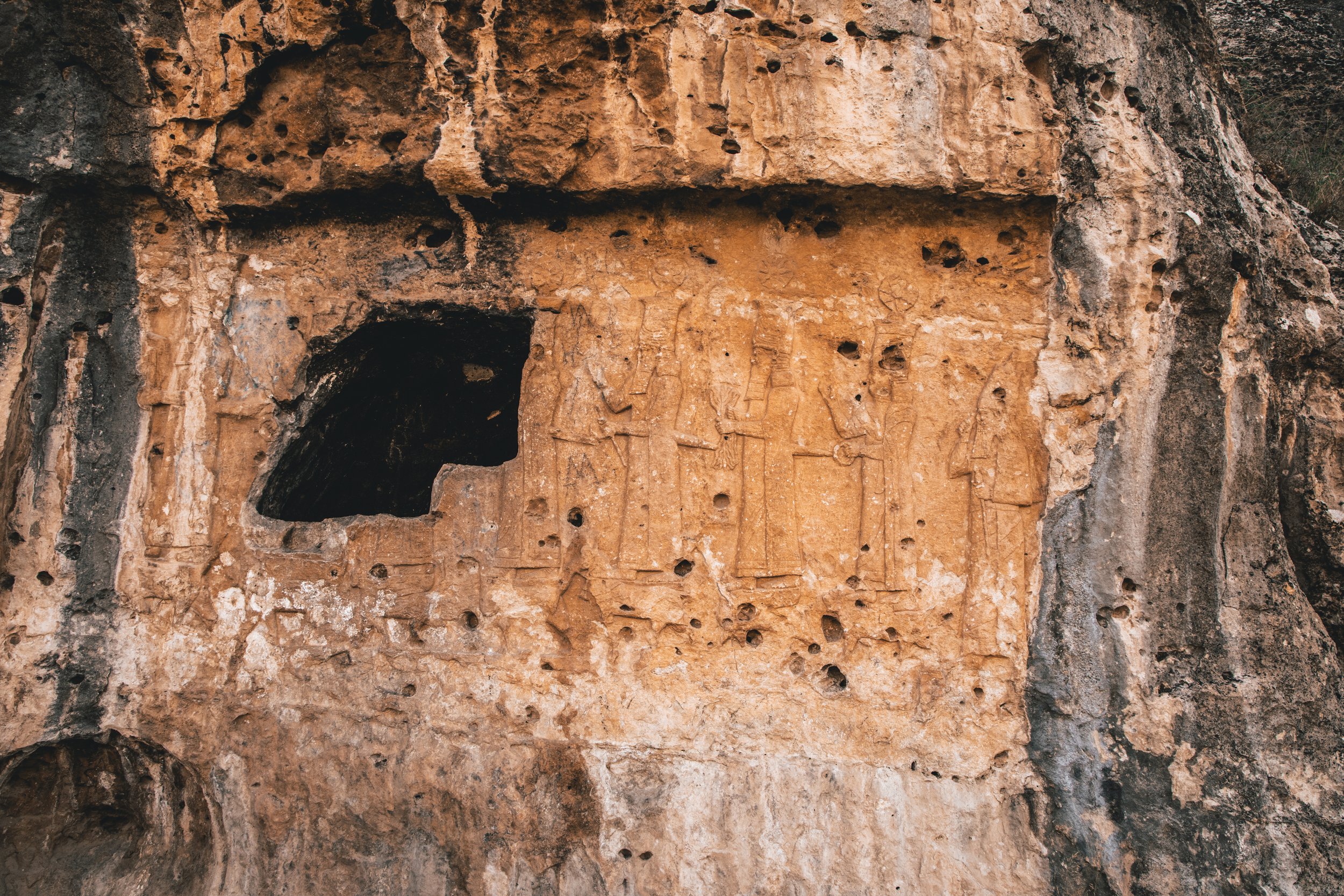 Iraq is the center of some of the oldest records we have of civilization. This region was once part of the Assyrian empire, and this cliff face is carved with their gods. It was made around 2,600 years ago.