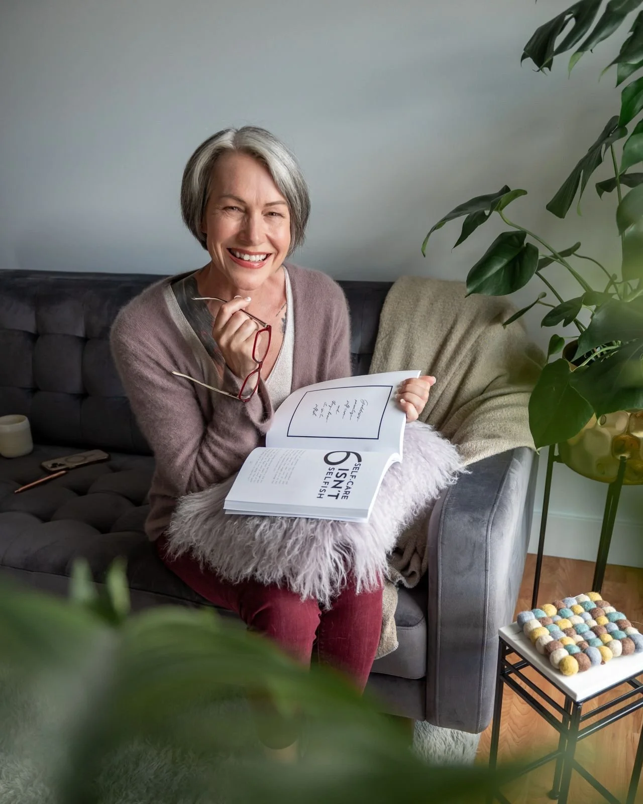 Emma Hull, life coach in Kamloops, sitting with a coaching workbook in a calm, welcoming space
