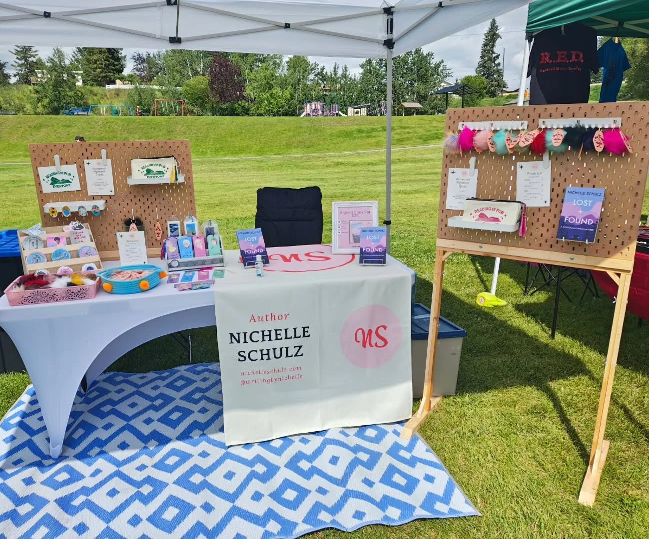 All set up at @100milepridesociety Pride in the Park. Weather is holding and there's lots of cute puppies around! 🩷🐶