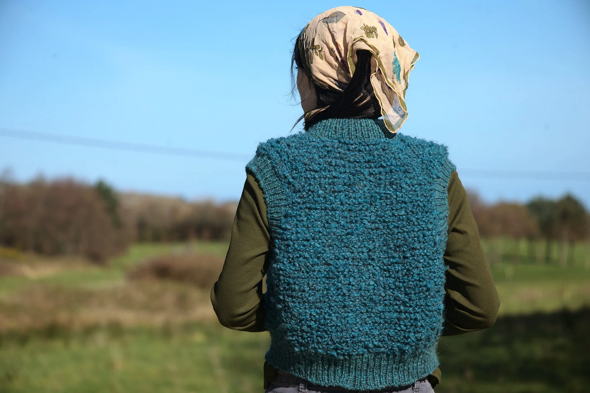 a raglan sleeve vest with unique construction 