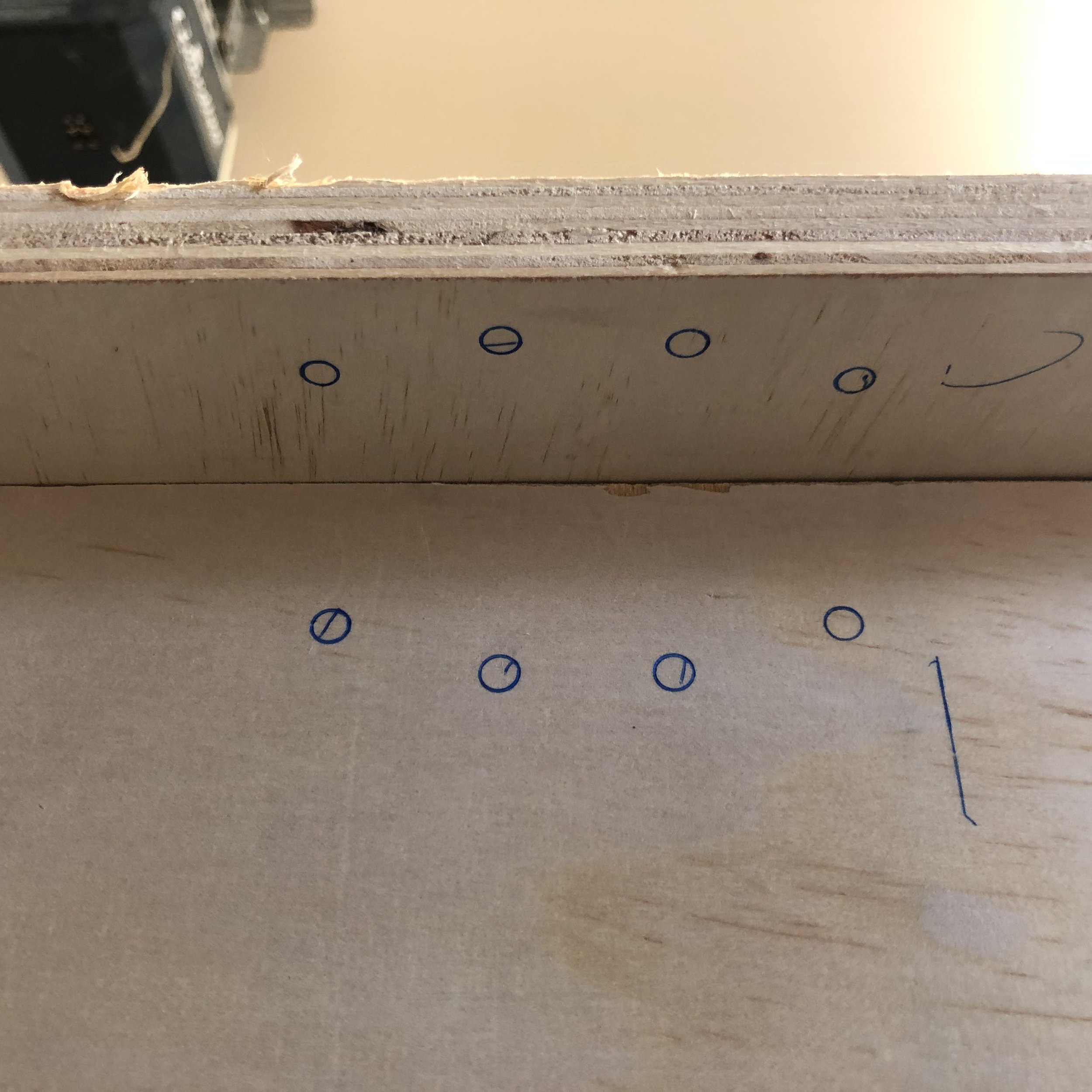 Hold hinge in place to mark holes