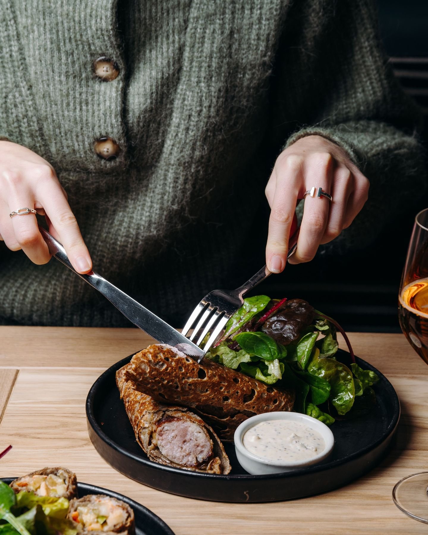 At Breizh Café, even the traditional galette saucisse is reinvented.

A buckwheat galette topped with sausage, melted Comté cheese, onion confit, and seasoned with a sauce.