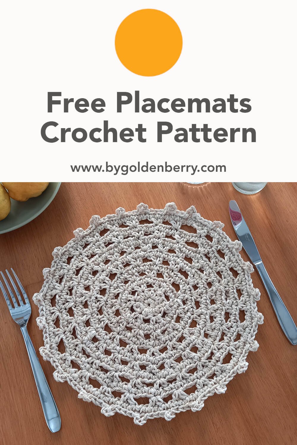 An image specifically for pinning to pinterest. The main image of the placemat sat on a wooden table with dark grey text on white above which reads "Free Placemats Crochet Pattern www.bygoldenberry.com"