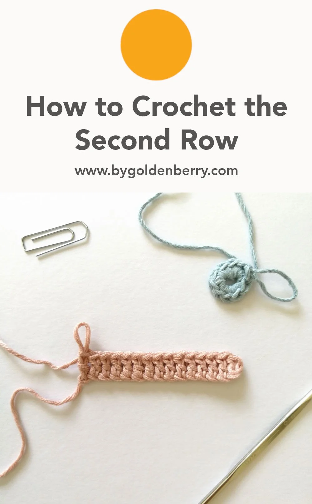 A birds eye view of two small samples of one row of crochet. One in rows, in pastel pink and the other in rounds in baby blue. The background is off white. Above, dark grey text reads "How to Crochet the Second row www.bygoldenberry.com"