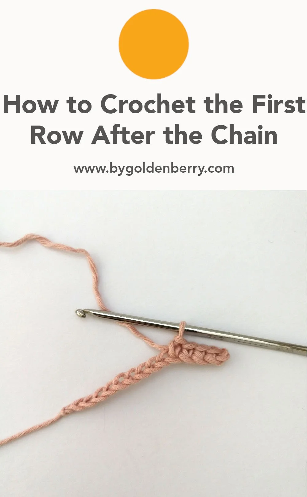A foundation chain made in pastel pink yarn with a few of the first row of stitches made. A silver crochet hook is through the loop. Above, dark grey text reads "How to Crochet the First Row After the Chain" and "www.bygoldenberry,com".