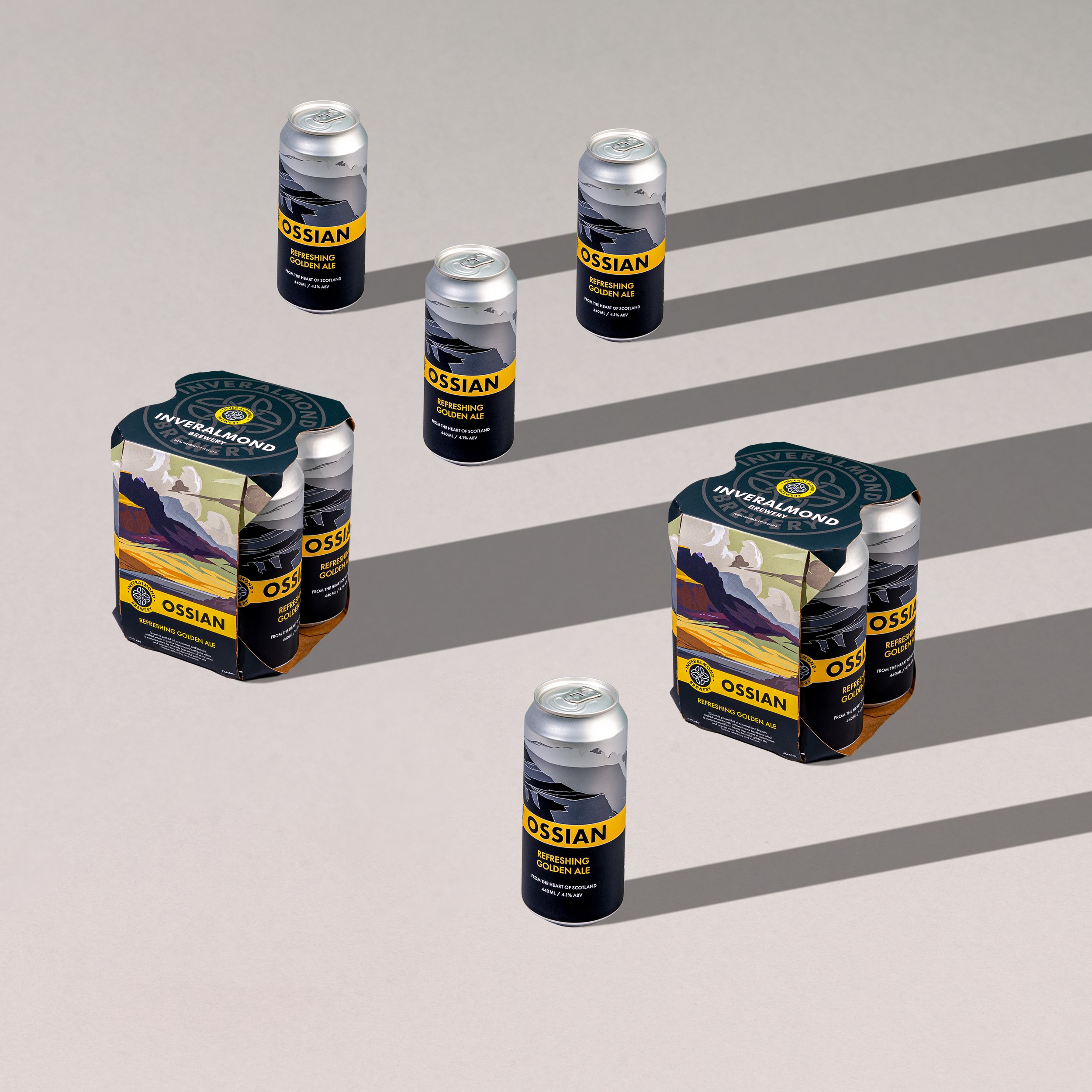Six cans of Ossian beer, with three in six-pack carriers and three placed individually on a light-colored surface, casting shadows.
