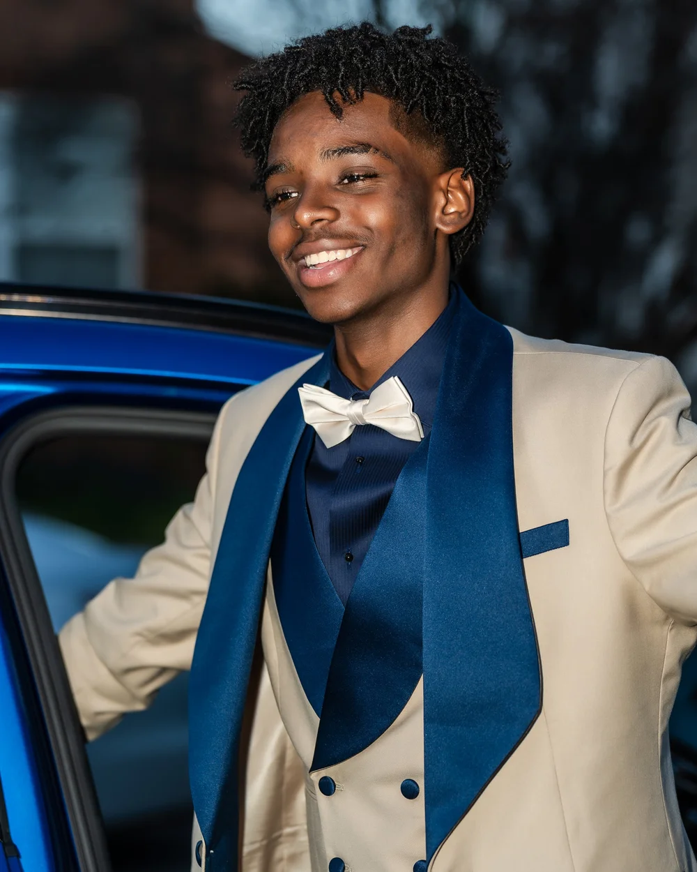 Detail of a blue tuxedo and bow tie before prom
