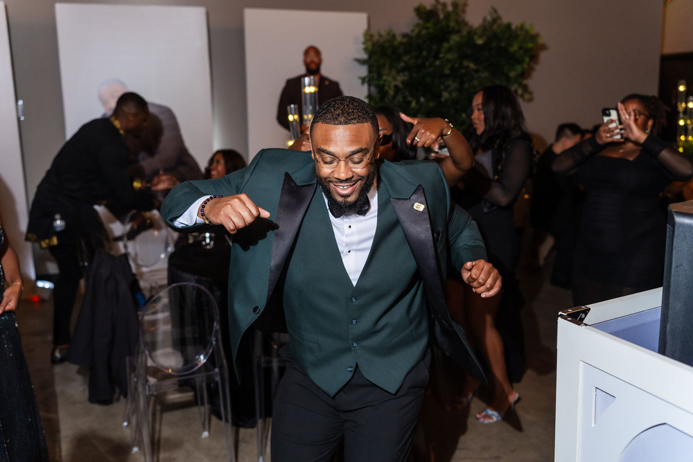 Two guests dancing in emerald tuxedos at a Baltimore birthday party