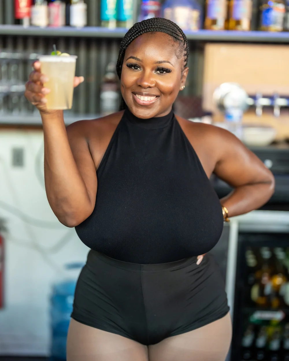 Guest in black at an all-white day party in Baltimore