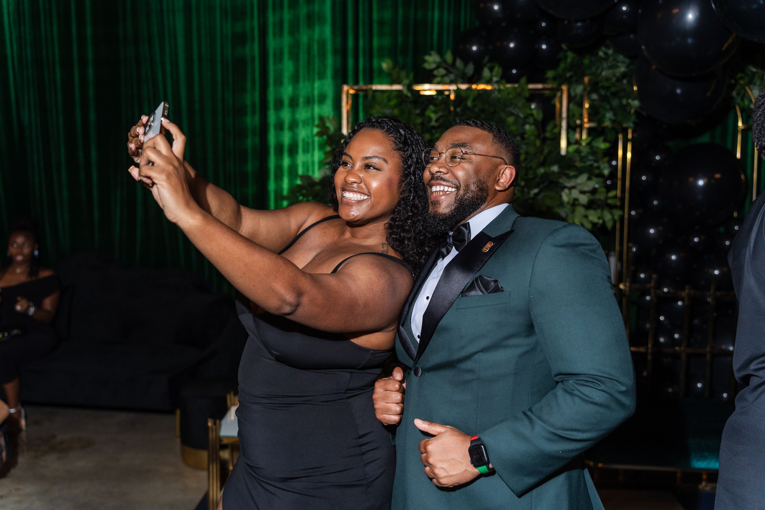 Guest laughing with the birthday host during a Maryland celebration