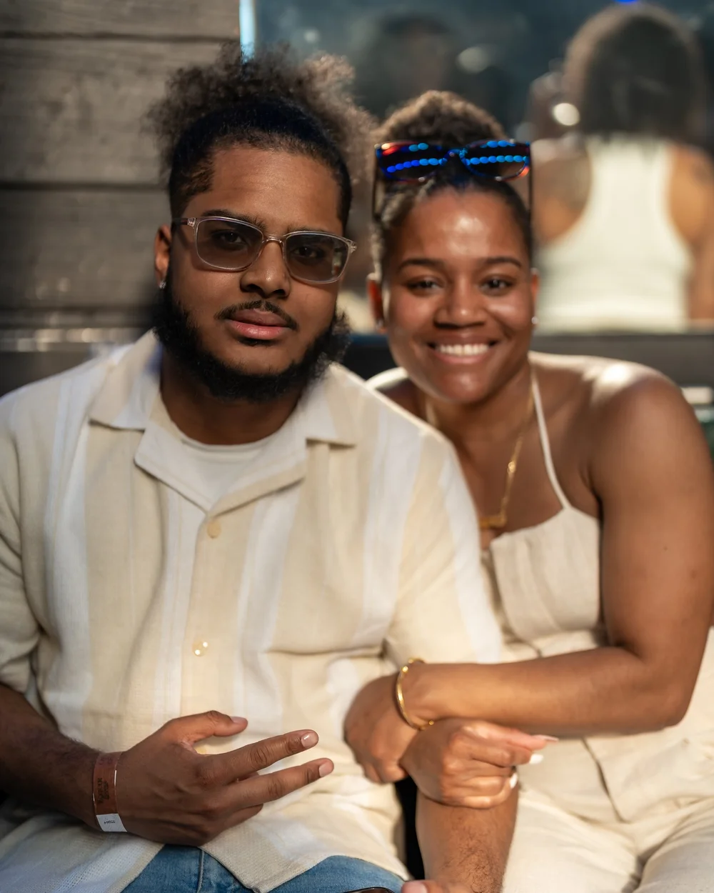 Two guests posing together at a Baltimore rooftop party
