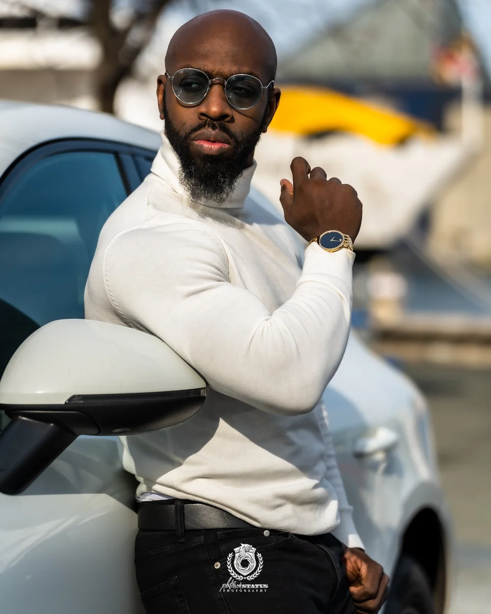On-location portrait of a man in a white sweater