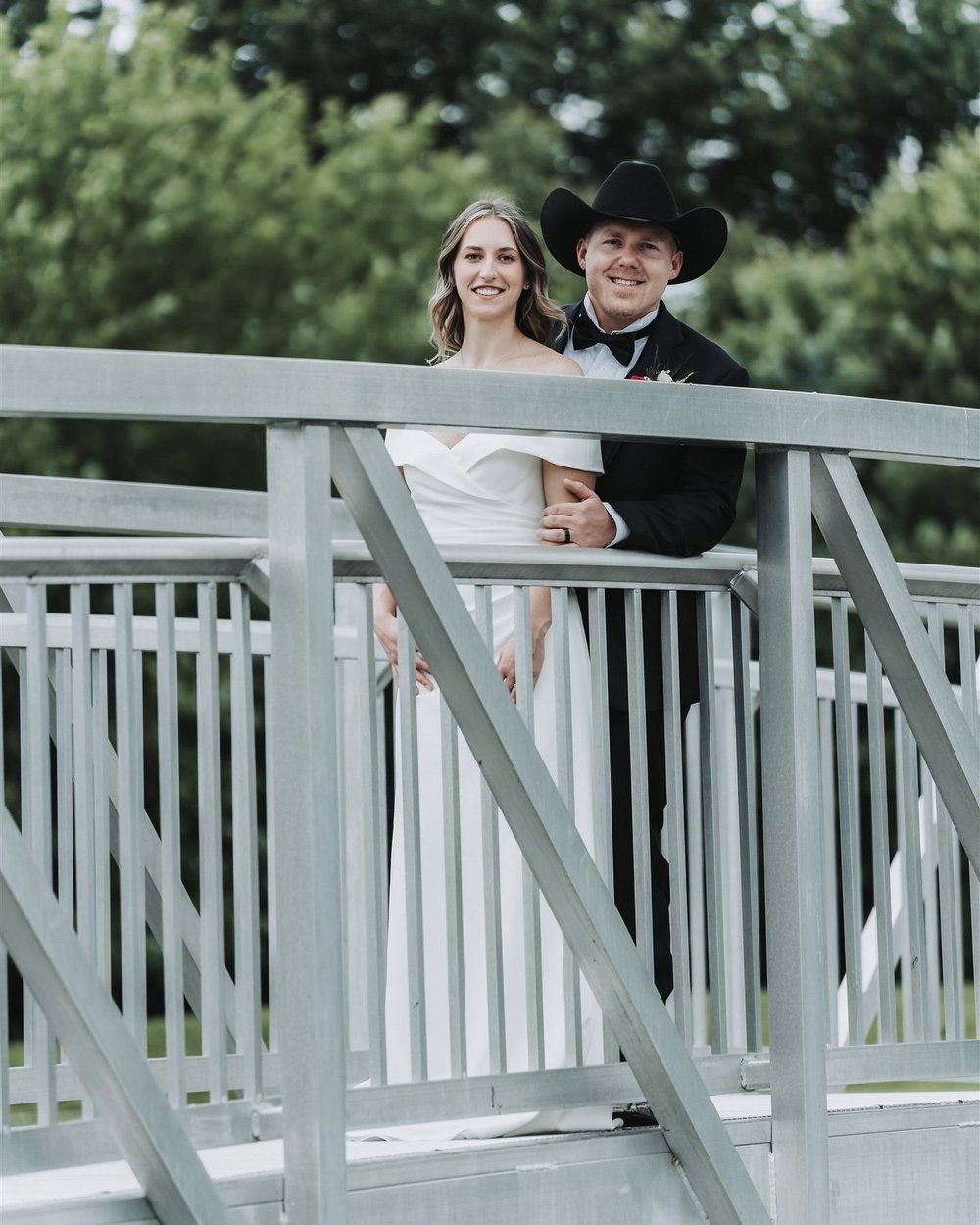 Bride and groom on a footbridge at their Maryland wedding