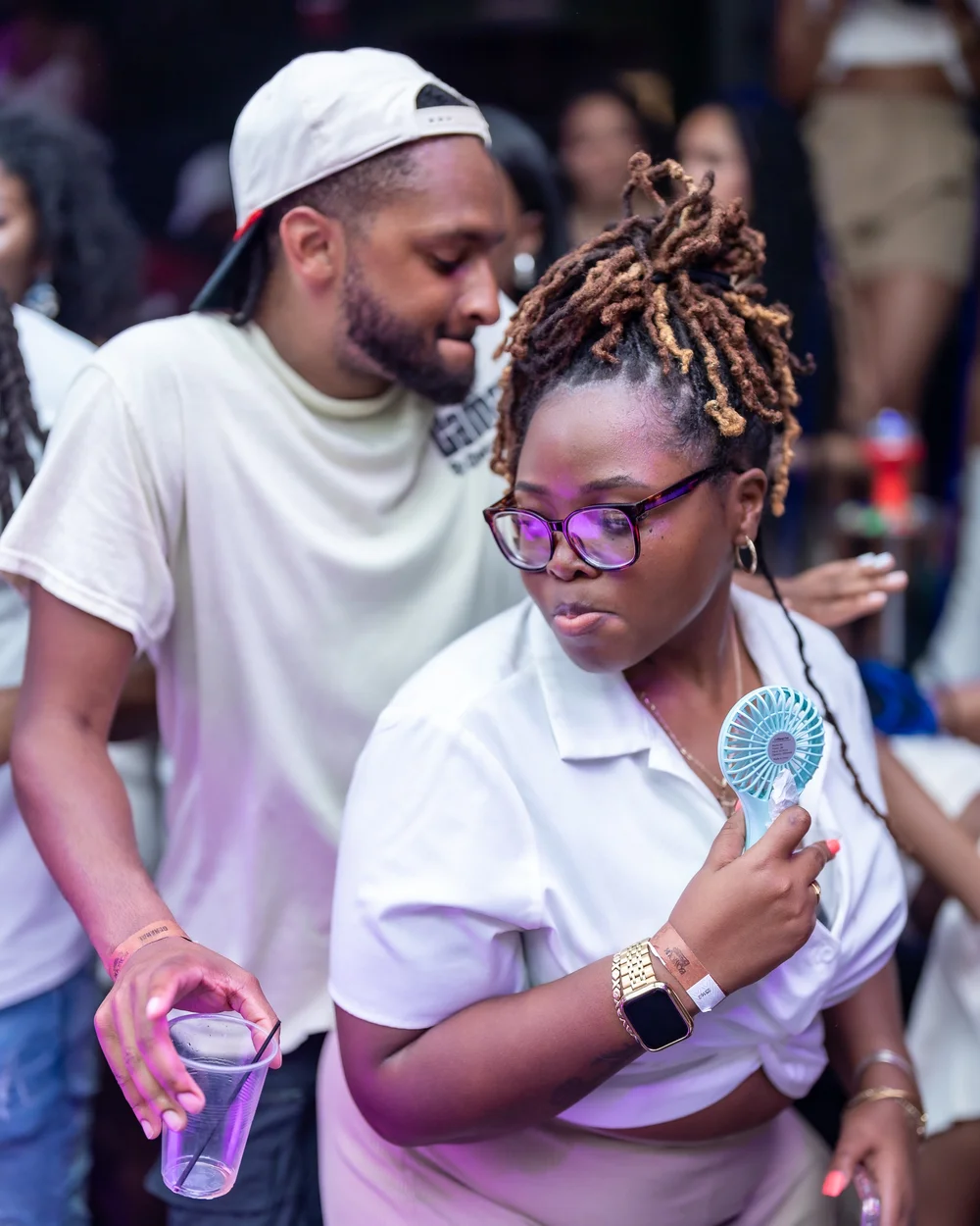 Guest in white sunglasses at an all-white summer party