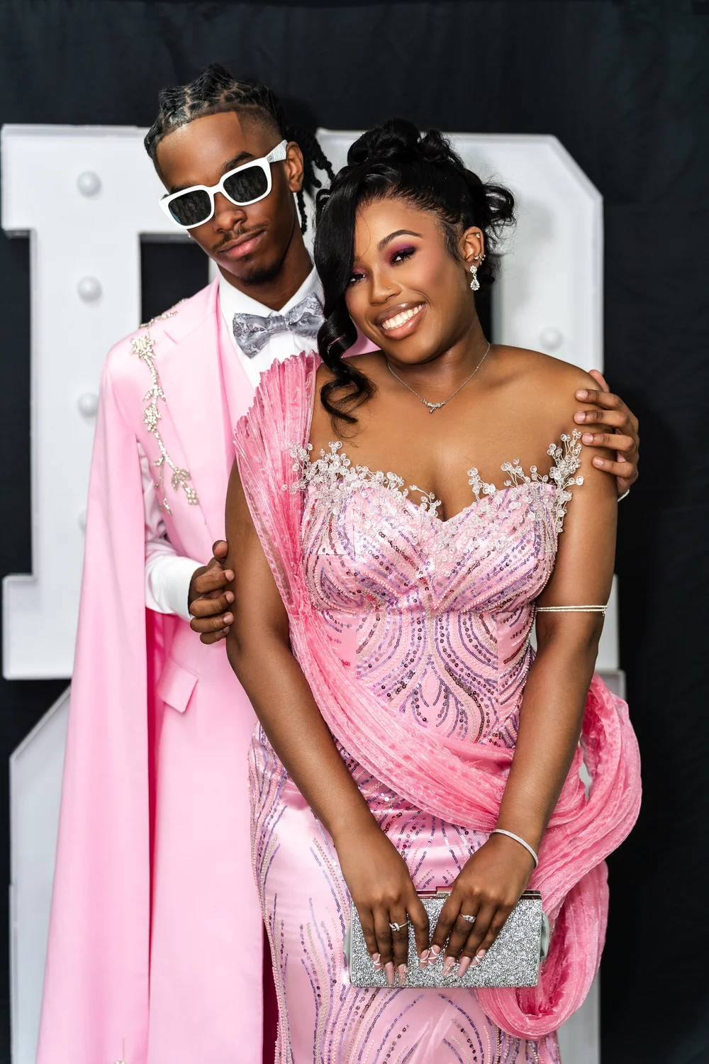 Prom portrait in a pink gown with balloon decor