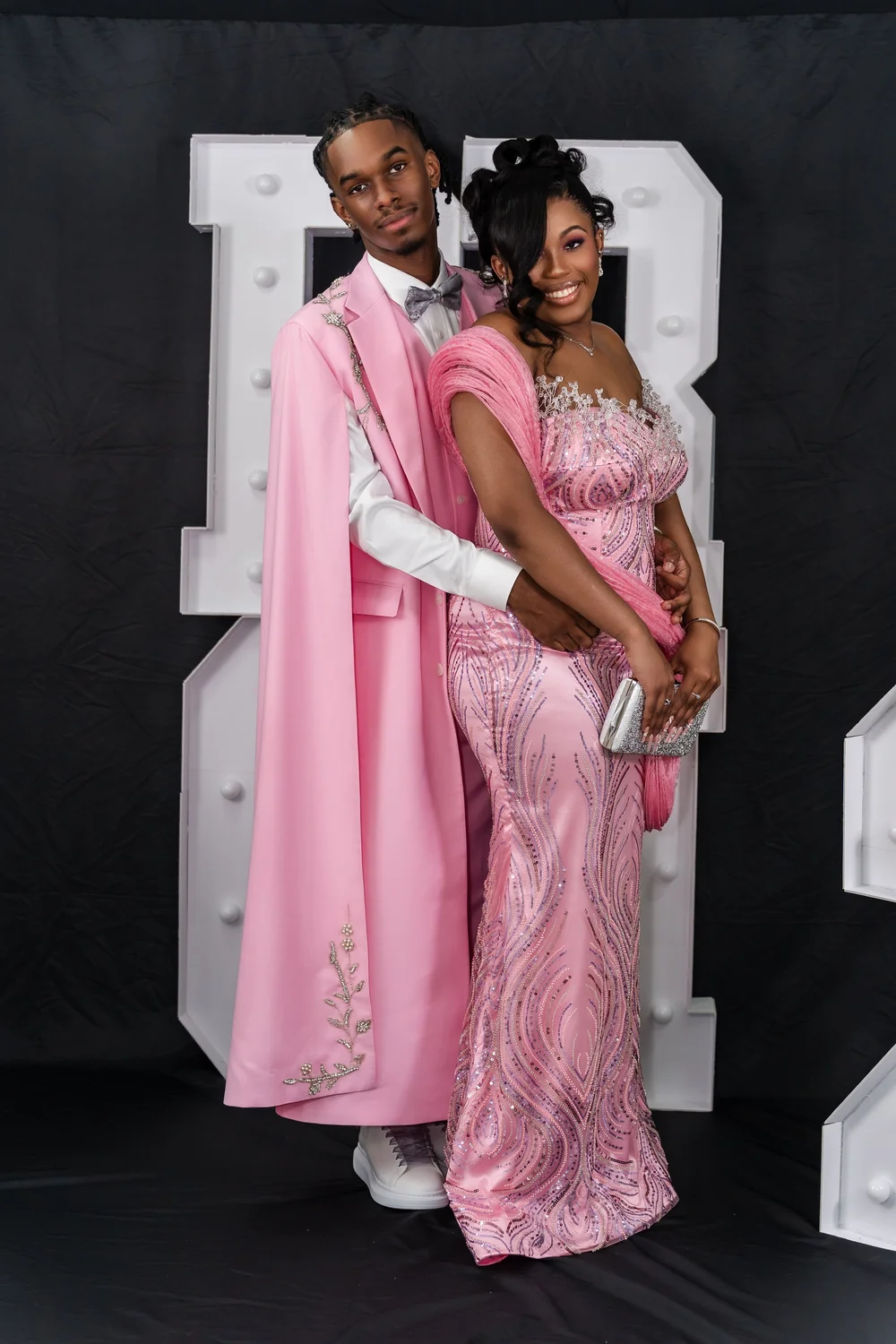 Prom sendoff portrait in a pink suit