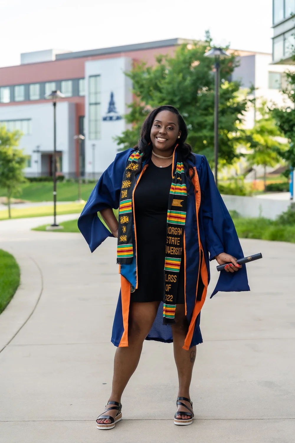Graduate in cap and gown with tassel turned