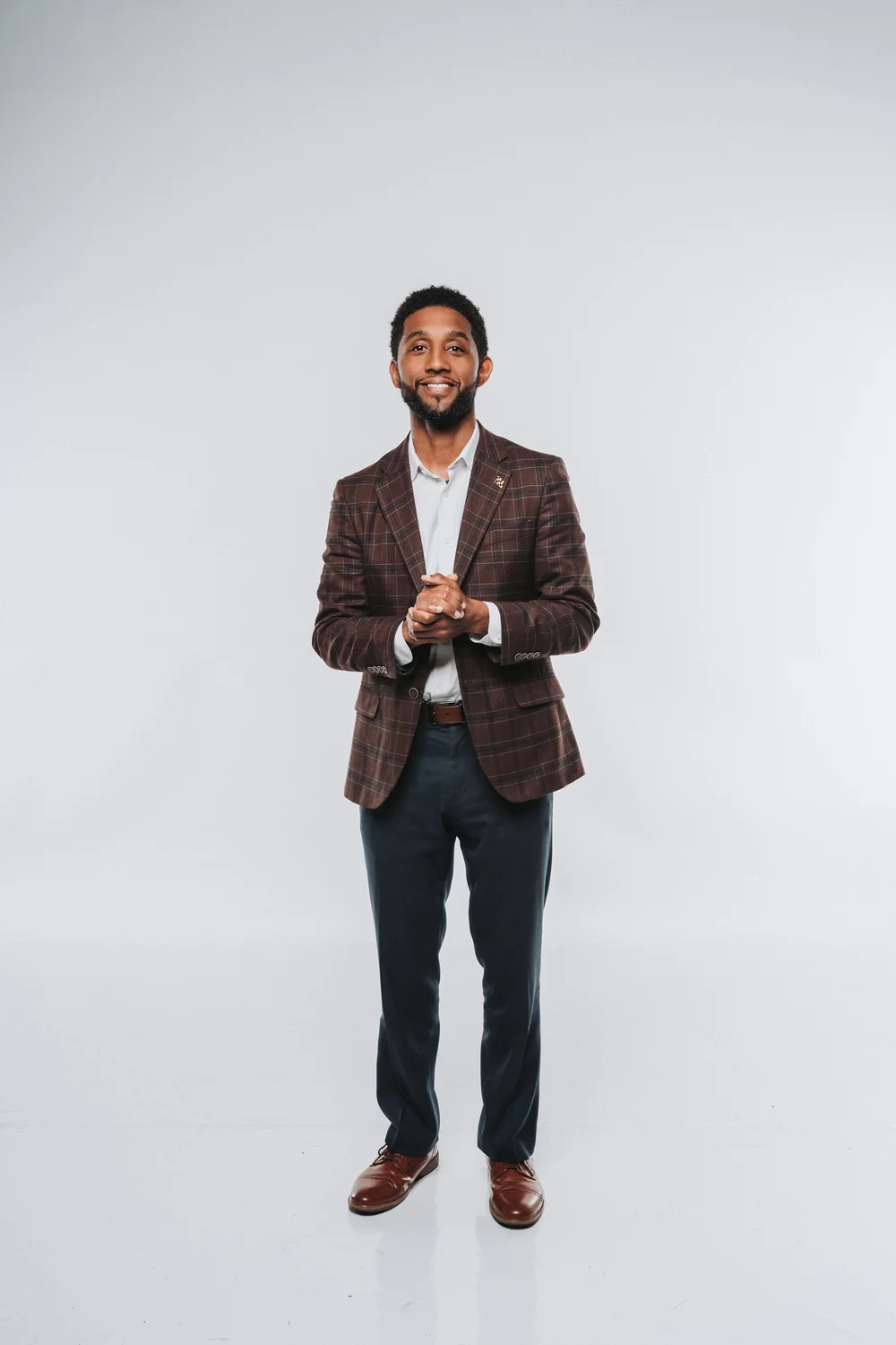 Studio portrait of a man in a dark blazer